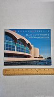 Front cover of book showing Monona Terrace building and title