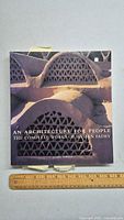 Front cover of hardcover architecture book featuring photo of domed building structures with triangular ventilation openings.
