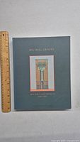 Front cover of the Michael Graves architecture book showing title and architectural illustration.