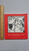 Front cover of the book 'The Situationist City' with red background and illustration.