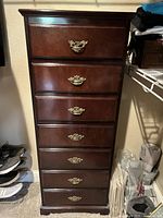 Front view of the dresser showing all seven drawers and brass handles, with some missing handles.