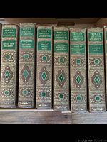 Close-up photo of spines of volumes 7 to 12 showing titles and decorative binding.