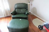 Front view of recliner chair and ottoman set on hardwood floor