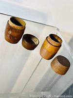 inkwells with lids removed showing interior cavities