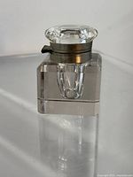Front view showing crystal inkwell and silver trim lid