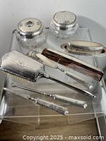 Group shot showing all eight Birks sterling dresser pieces