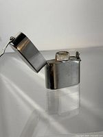 Case with lid open showing interior bottle recess