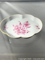 Top view showing full dish, floral design and gold rim