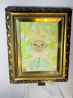 Full view of framed painting on display stand