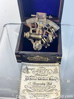 Sextant in open lined box with label visible