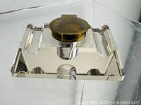 Top view closed lid showing pen slots and brass lid on crystal body