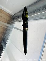 Full view of pen showing cap, clip, band and overall coloration