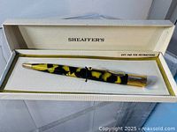 Pen displayed inside open Sheaffer’s box