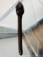 Overall view of copper yatate showing dragon head finial and shaft