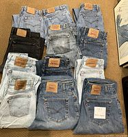 Overhead view showing all twelve folded pairs laid out on floor.