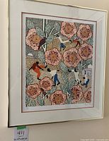 Framed colorful art print depicting stylized floral patterns and human figures