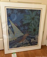 Framed artwork showing sailboat, moon, water, and plant with detailed geometric patterns.