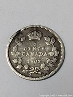 Reverse side showing crowned wreath surrounding denomination and date.