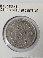Obverse side of 1912 Newfoundland 20 cents coin in protective holder showing denomination and year