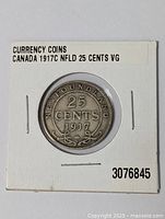 Image showing the front side of the 1917 Newfoundland 25 cents silver coin in a white cardboard holder with text 'Canada 1917C NFLD 25 Cents VG.'