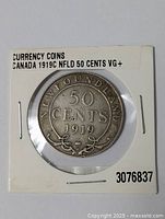 Obverse side of the 1919C Newfoundland 50 cent coin in protective display with label indicating VG+ condition.