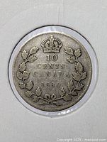 Close-up photo of the 1930 Canadian silver 10 cent coin showing details of crown, denomination, year, and maple leaf wreath.