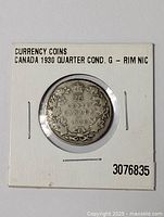 Canadian 1930 silver quarter coin in holder showing the reverse side with denomination and date.