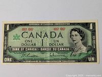 Front face of the 1967 Canadian Centennial one dollar bill showing Queen Elizabeth II and bilingual denomination markings.