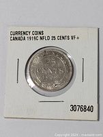 Coin in protective holder labeled with 'CANADA 1919C NFLD 25 CENTS VF+' and a number '3076840'