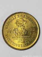 Front side of the 1978 Klondike Mike Salutes XI Commonwealth Games commemorative coin showing mascot and text.