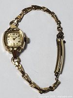Full view of the gold filled ladies Bulova watch with linked bracelet, showing length and clasp.