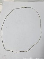 Full view of the 18 inch sterling silver chain necklace laid flat on a white background showing entire chain and clasp.