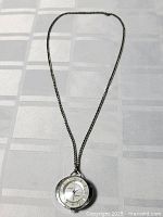 Full view of the vintage watch necklace showing the entire 18-inch chain and circular watch pendant.