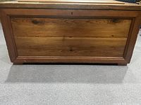 Bottom panel view of the chest highlighting natural wood grain and construction style.