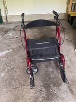 Front-facing view of the Fusion combination wheelchair/walker showing seat, storage pouch, backrest, handles, and wheels.