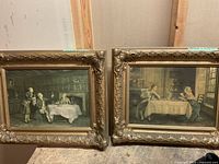 Two ornate framed oil canvas prints by EM Bennett displayed side by side