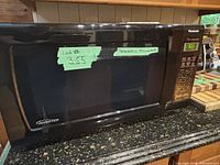 Front and side view of Panasonic inverter microwave showing keypad, digital display and inverter label.
