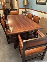 Overall view of table and six chairs in dining room setting