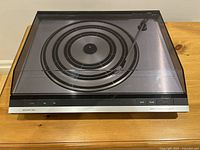 Front view of Beogram 3404 with dust cover in place