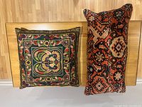 Curtain and two pillow covers with multicolor embroidery and orange-black geometric pattern