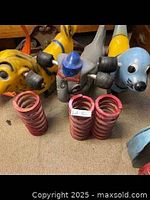 Front view of all three animal spring riders with coil springs stacked in front