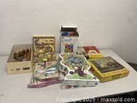 Full view of all assorted puzzle and game boxes including wooden block puzzles, cootie game, jigsaw puzzles.
