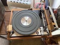 Top view of the turntable platter and tonearm, showing the condition of the platter and controls.