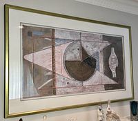 Framed abstract painting showing textured geometric shapes, prominently featuring a large brown and pink circular form, signed by the artist in the bottom right corner.