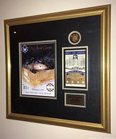 Gold-tone frame containing black-matted Maple Leaf Gardens final game memorabilia