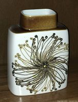 Front angle view of the vintage Royal Copenhagen pottery vase showing the abstract floral design and brown glazed top.