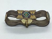 Full-length view of bracelet on white background