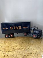 Full side view of truck and trailer showing overall shape and graphics