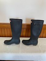 Full side view of both boots showing height and overall condition