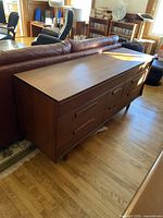 Front and top view of teak long bureau dresser